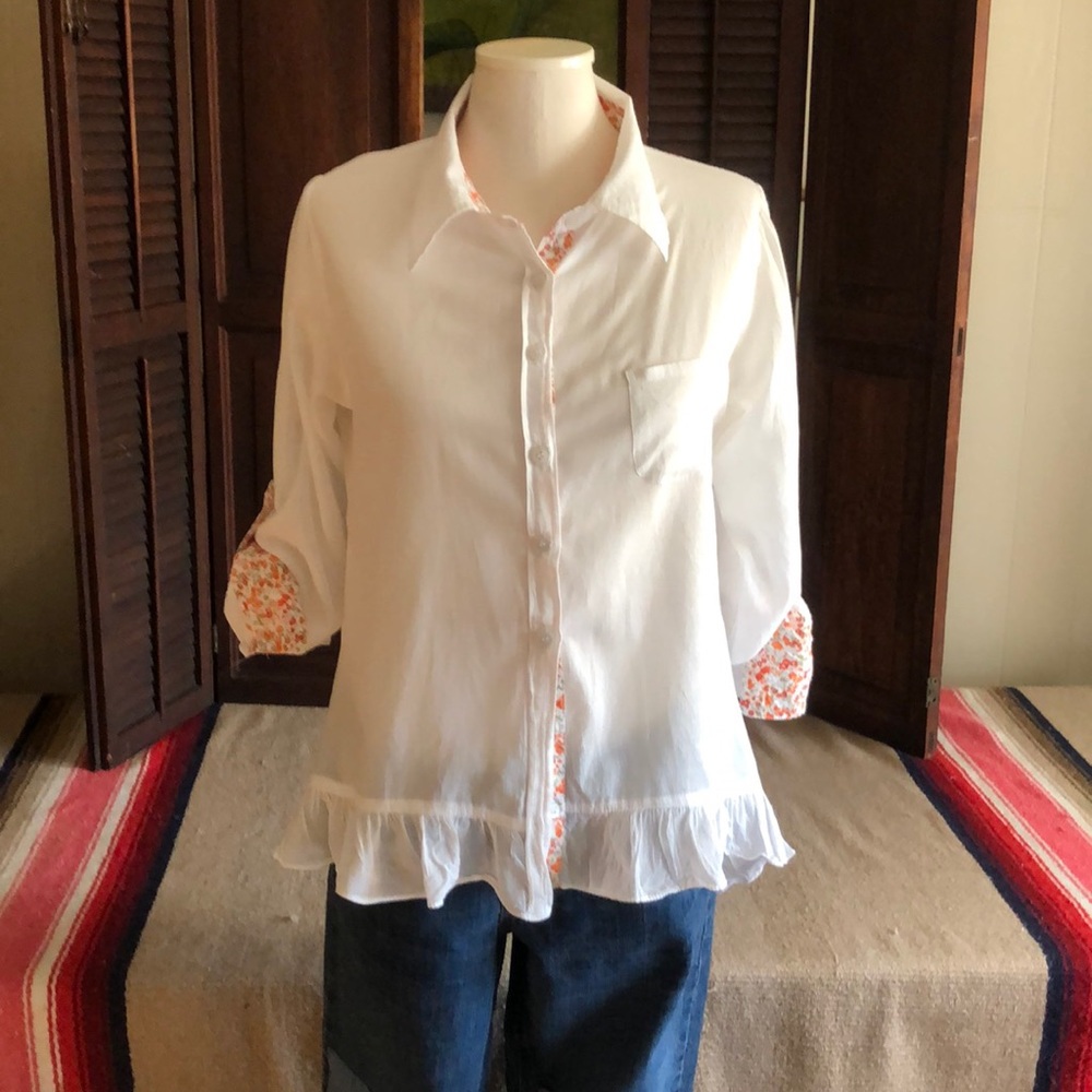 Flutterbye white button down ruffled hemline top